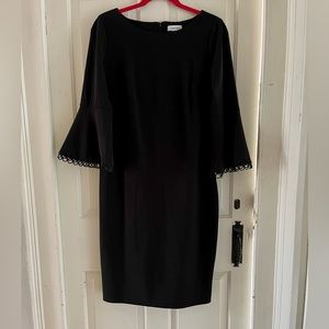 Black dress with bell sleeves — great for the office!